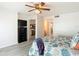Bedroom with ocean view, ceiling fan and dresser at 3333 S Atlantic Ave # 605, Daytona Beach Shores, FL 32118