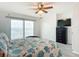 Bedroom featuring ocean view, ceiling fan, and dresser at 3333 S Atlantic Ave # 605, Daytona Beach Shores, FL 32118