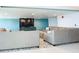 Comfortable community room with large sectional sofa and TV at 3333 S Atlantic Ave # 605, Daytona Beach Shores, FL 32118