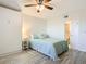 Bright bedroom with a queen bed, ceiling fan, and access to a bathroom at 3333 S Atlantic Ave # 605, Daytona Beach Shores, FL 32118
