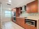Updated kitchen with stainless steel appliances and wood cabinets at 3333 S Atlantic Ave # 605, Daytona Beach Shores, FL 32118