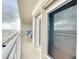 Balcony with ocean view, white railing, and patio furniture at 3333 S Atlantic Ave # 605, Daytona Beach Shores, FL 32118
