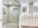 Updated bathroom with a walk-in shower, double vanity, and modern fixtures at 3333 S Atlantic Ave # 605, Daytona Beach Shores, FL 32118
