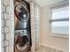 Stackable washer and dryer in a convenient laundry closet at 3333 S Atlantic Ave # 605, Daytona Beach Shores, FL 32118