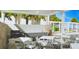 Community outdoor kitchen with grills and dining area at 3333 S Atlantic Ave # 605, Daytona Beach Shores, FL 32118