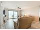 Living room features ocean view, sliding glass doors, and comfy leather furniture at 3333 S Atlantic Ave # 605, Daytona Beach Shores, FL 32118