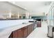 Community kitchen with white tile backsplash and modern cabinets at 3333 S Atlantic Ave # 605, Daytona Beach Shores, FL 32118