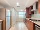 Updated kitchen with stainless steel appliances and wood cabinets at 3333 S Atlantic Ave # 605, Daytona Beach Shores, FL 32118