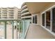 Private balcony overlooks the community pool and lush landscape at 4 Oceans West Blvd # 301C, Daytona Beach Shores, FL 32118