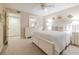 Bedroom with white bedding and coastal decor at 4 Oceans West Blvd # 301C, Daytona Beach Shores, FL 32118