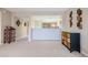Open concept living room with kitchen view and neutral decor at 4 Oceans West Blvd # 301C, Daytona Beach Shores, FL 32118