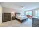Spacious bedroom with ample closet space and a ceiling fan at 4 Oceans West Blvd # 301C, Daytona Beach Shores, FL 32118