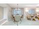 Dining area with round table and chairs, adjacent to living room at 4 Oceans West Blvd # 301C, Daytona Beach Shores, FL 32118