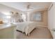 Bedroom with white furniture and ceiling fan at 4 Oceans West Blvd # 301C, Daytona Beach Shores, FL 32118