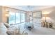 Bright living room features sliding doors to balcony and neutral decor at 4 Oceans West Blvd # 301C, Daytona Beach Shores, FL 32118