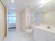 Bathroom with toilet and vanity, and bedroom view at 4 Oceans West Blvd # 301C, Daytona Beach Shores, FL 32118