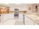 Modern kitchen with white cabinets, stainless steel appliances and granite countertops at 4 Oceans West Blvd # 301C, Daytona Beach Shores, FL 32118