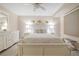 Bedroom with white furniture and coastal decor at 4 Oceans West Blvd # 301C, Daytona Beach Shores, FL 32118