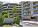 Cloverleaf North building exterior, featuring parking and landscaping at 4 Oceans West Blvd # 301C, Daytona Beach Shores, FL 32118