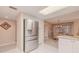 Modern kitchen with white cabinets, stainless steel appliances and granite countertops at 4 Oceans West Blvd # 301C, Daytona Beach Shores, FL 32118