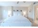 Bright bedroom with white bedding and coastal decor at 4 Oceans West Blvd # 301C, Daytona Beach Shores, FL 32118