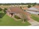 Single-story house with brown roof and landscaped yard at 4747 Nw 35Th Lane Rd, Ocala, FL 34482