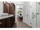 Bathroom with granite countertop, double sinks, and shower at 4747 Nw 35Th Lane Rd, Ocala, FL 34482
