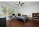 Bright bedroom with large windows, hardwood floors, and built-in workspace at 4747 Nw 35Th Lane Rd, Ocala, FL 34482