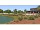 Community clubhouse with outdoor seating overlooking a golf course and pond at 4747 Nw 35Th Lane Rd, Ocala, FL 34482