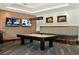 Game room with pool table, comfortable seating, and large screen TVs at 4747 Nw 35Th Lane Rd, Ocala, FL 34482