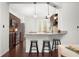 Modern kitchen with granite countertops, dark wood cabinets, and breakfast bar at 4747 Nw 35Th Lane Rd, Ocala, FL 34482