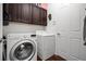 Bright laundry room, featuring washer, dryer, and ample cabinetry at 4747 Nw 35Th Lane Rd, Ocala, FL 34482