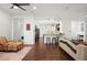 Open living room with hardwood floors and view to kitchen at 4747 Nw 35Th Lane Rd, Ocala, FL 34482