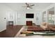 Bright living room featuring hardwood floors, large windows, and ample natural light at 4747 Nw 35Th Lane Rd, Ocala, FL 34482