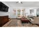 Bright living room with comfy seating, large windows, and stylish rug at 4747 Nw 35Th Lane Rd, Ocala, FL 34482