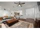 Spacious living room with hardwood floors, comfortable seating, and access to kitchen at 4747 Nw 35Th Lane Rd, Ocala, FL 34482