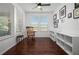 Home office with built-in shelving and hardwood floors at 4747 Nw 35Th Lane Rd, Ocala, FL 34482