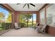 Relaxing screened porch with comfortable seating and view of backyard at 4747 Nw 35Th Lane Rd, Ocala, FL 34482