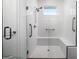 Walk-in shower with built-in seat and grab bars at 4747 Nw 35Th Lane Rd, Ocala, FL 34482