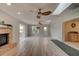 Bright living room with hardwood floors, fireplace, and sliding doors to deck at 4766 S Atlantic Ave, Ponce Inlet, FL 32127