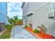 Neat side yard with walkway leading to home entrance at 4766 S Atlantic Ave, Ponce Inlet, FL 32127