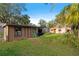 Spacious backyard with a shed and lush greenery at 6 Rosalie Oaks Blvd, Lake Wales, FL 33898