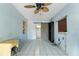 Bright bonus room with tile floors, ceiling fan, and built-in shelving at 6 Rosalie Oaks Blvd, Lake Wales, FL 33898