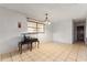 Bright dining room with tile floors and a chandelier at 6 Rosalie Oaks Blvd, Lake Wales, FL 33898