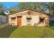 House exterior featuring a classic design and a well-maintained lawn at 6 Rosalie Oaks Blvd, Lake Wales, FL 33898