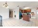 Kitchen features dark wood cabinets, an island, and black appliances at 6 Rosalie Oaks Blvd, Lake Wales, FL 33898