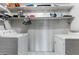 Laundry room with washer, dryer, and ample shelving at 6 Rosalie Oaks Blvd, Lake Wales, FL 33898
