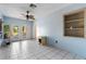 Laundry area with tile floors, French doors, and built-in shelving at 6 Rosalie Oaks Blvd, Lake Wales, FL 33898