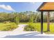 Peaceful backyard with patio and waterfront views at 6178 Knotty Pine Ct, Port Orange, FL 32127