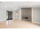 Spacious living room with light wood floors and a modern fireplace at 6178 Knotty Pine Ct, Port Orange, FL 32127